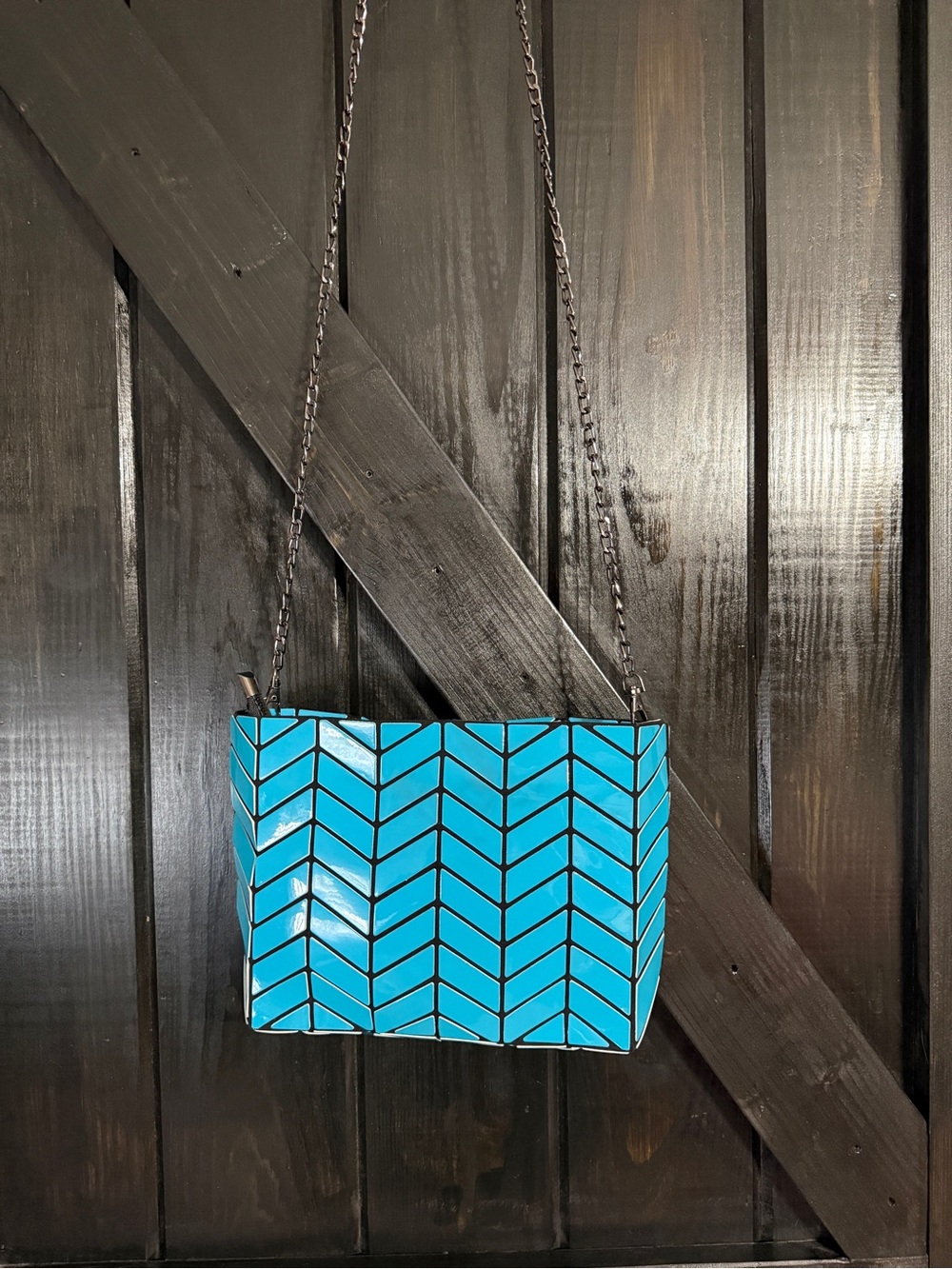 Patrizia Luca geometric turquoise chevron crossbody bag with a chain strap
